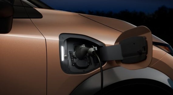 Close-up image of charging cable plugged in | Mountain View Nissan of Dalton in Dalton GA